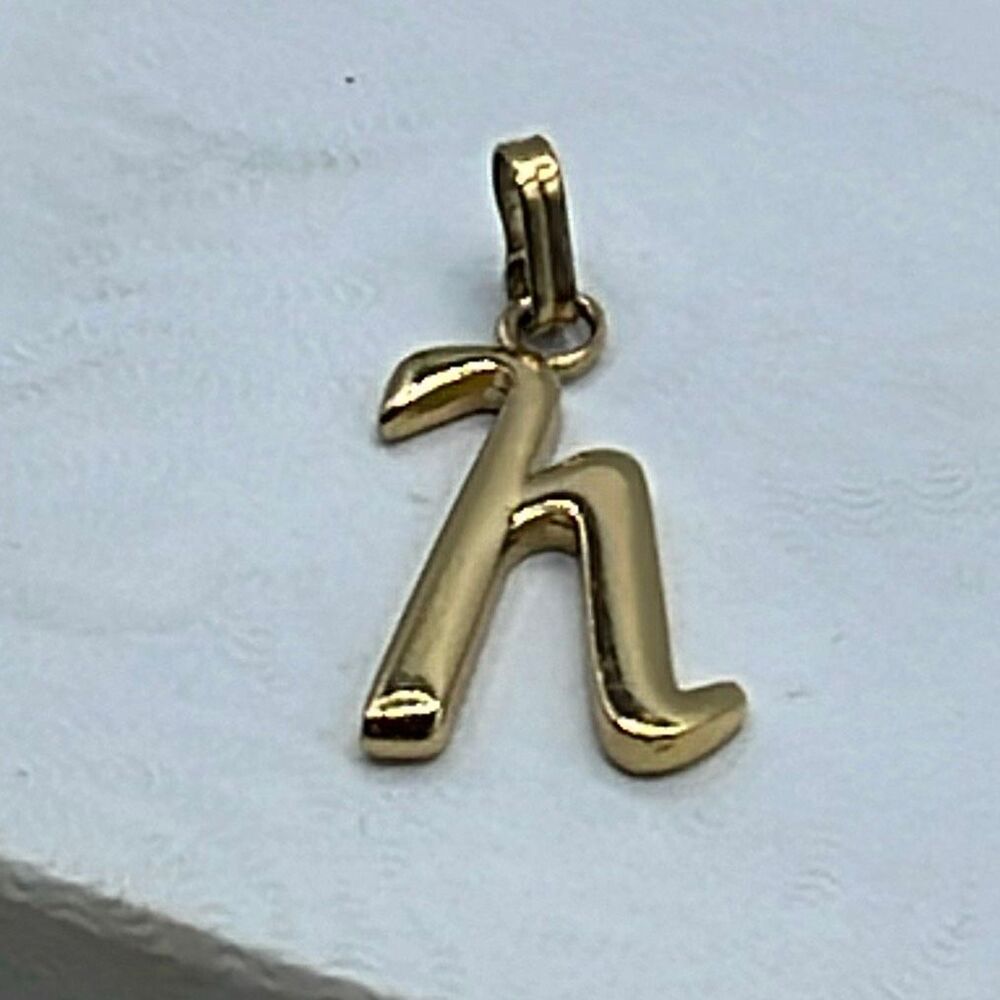 Vintage Monet gold plated lower case h pendant.